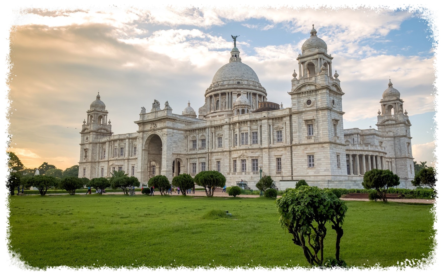 A majestic view of the white palace in India, showcasing its intricate architecture and serene surroundings.